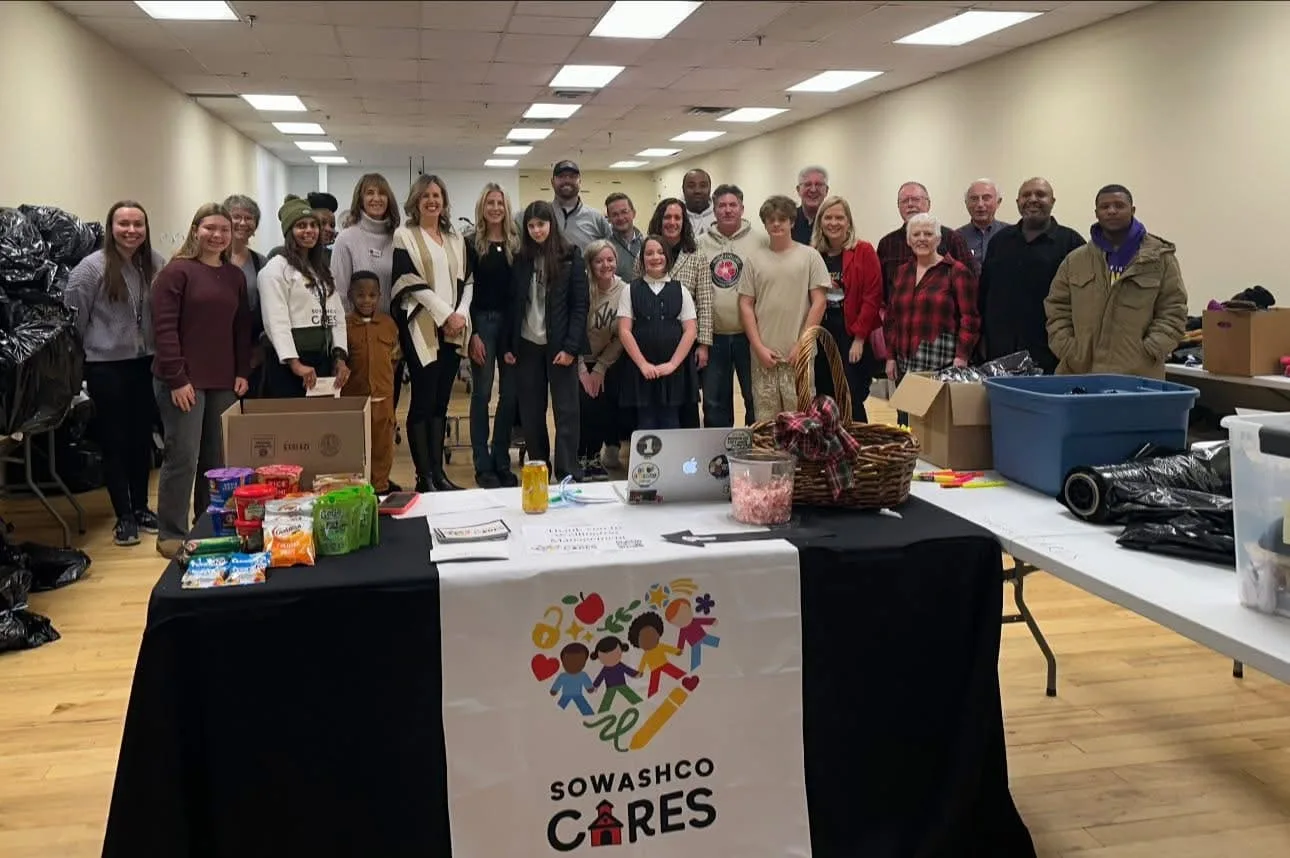 Volunteers at a community clothing and food drive in Woodbury